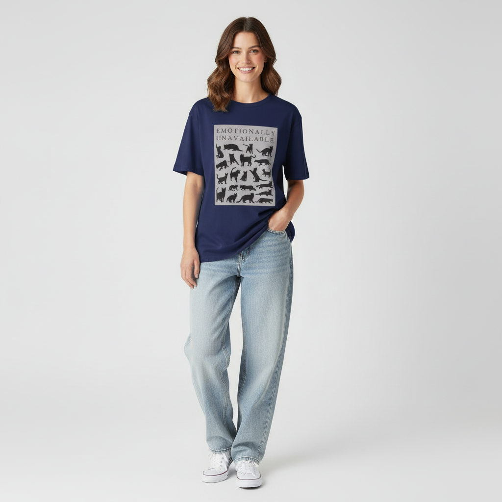 Woman wearing a blue t-shirt with animal illustrations and light blue jeans on a white background