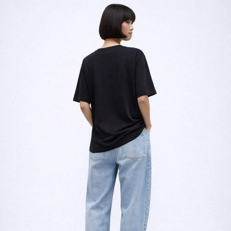 Person wearing a black t-shirt