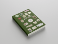 Green book with various stickers on a gray background
